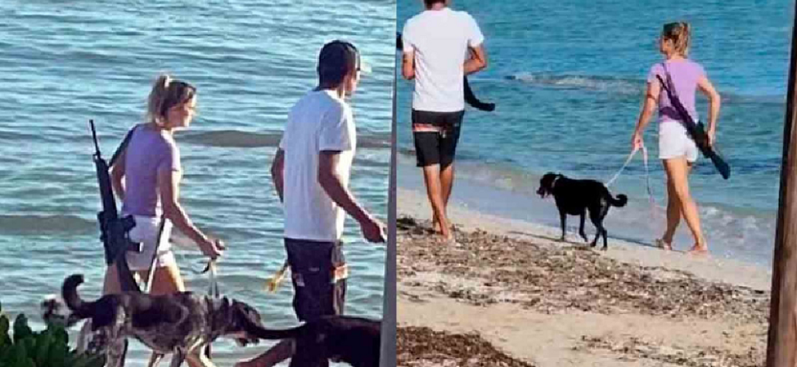 Turista se pasea por playas de Yucatán con un rifle